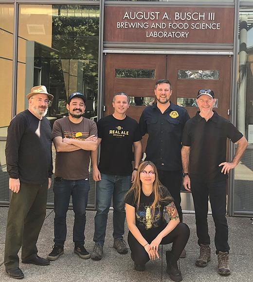online Master Brewers grad Alex Kandel poses with members from his cohort outside the UC Davis Brewing and Food Science Lab