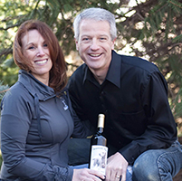 Winemaking Certificate grad Michael Budd with wife and wine bottle