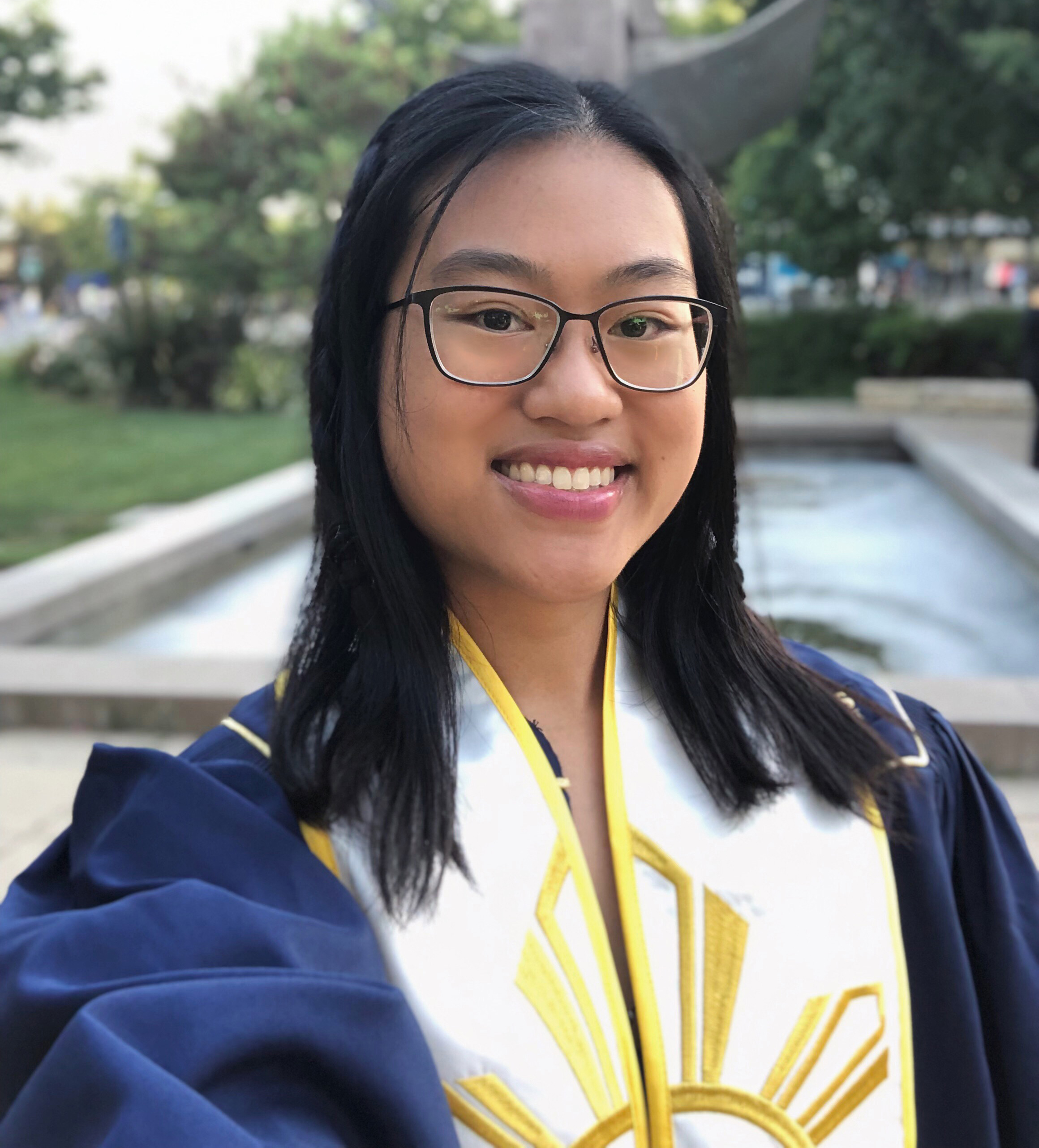 headshot of Public Health Certificate student Ellaine Arroyo in graduation gown 