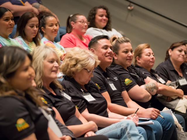 food professionals from California school districts sit and listen to a presentation during a training event